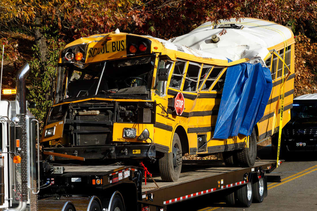 A wrecker removes the school bus from the scene of a crash on Talley Road on Tuesday, Nov. 22, 2016, in Chattanooga, Tenn. The Monday afternoon crash killed at least 5 elementary schoolchildren and injured dozens more. The NTSB has been called in to help investigate.  (Photo by Doug Strickland / Chattanooga Times Free Press)